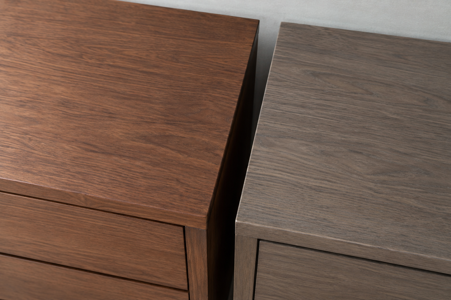A warm walnut piece and a gray-washed oak piece of similar value shown together as a wood tone mismatch