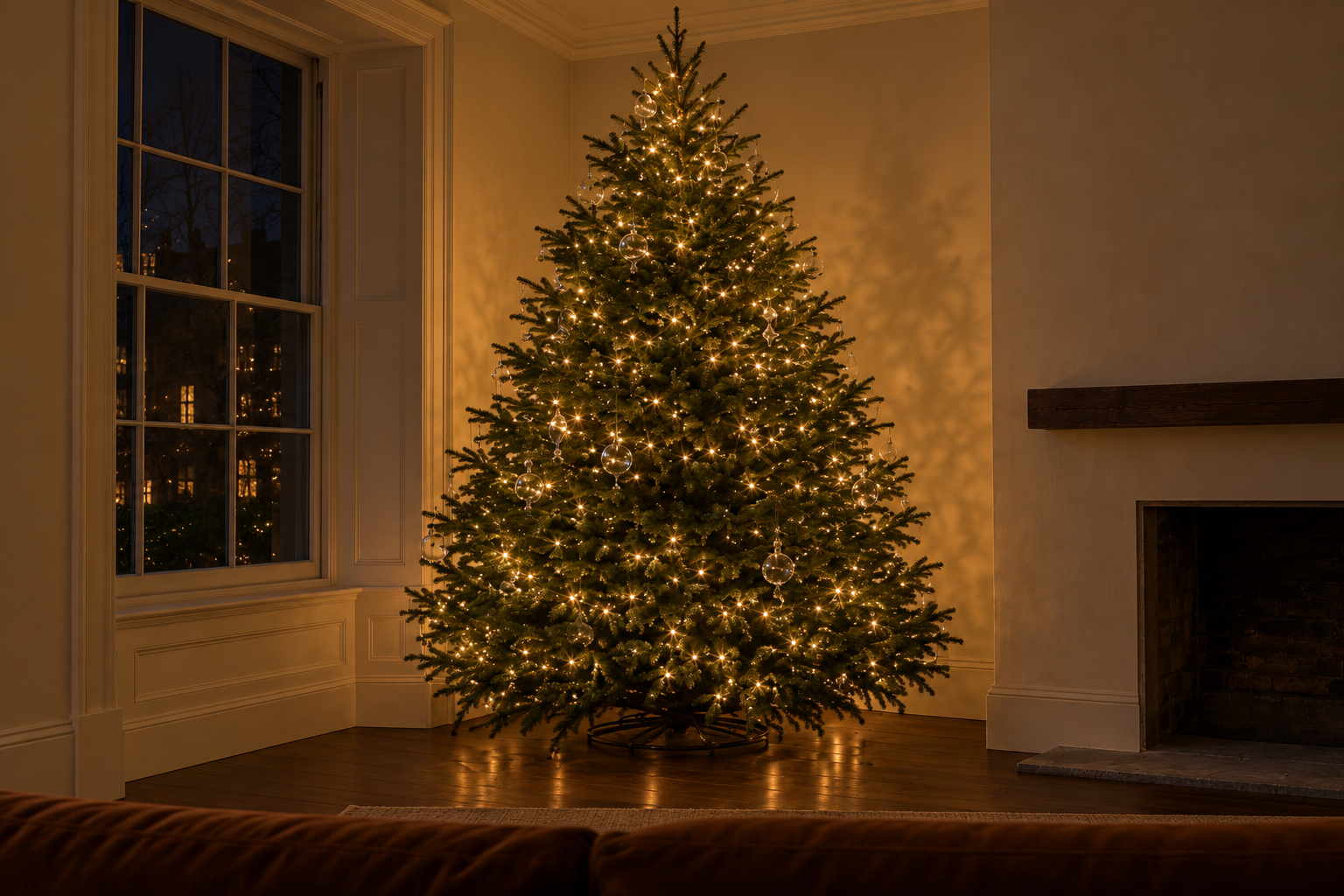 A Christmas tree glowing evenly from top to bottom in a dark living room.