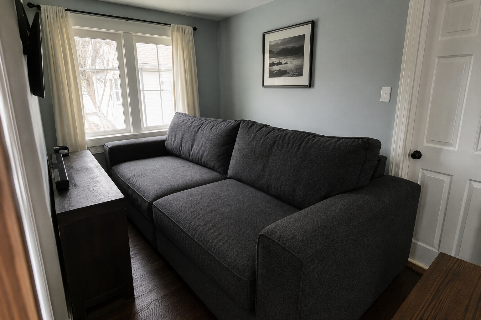 A sofa too large for its living room, leaving no real walking path around it