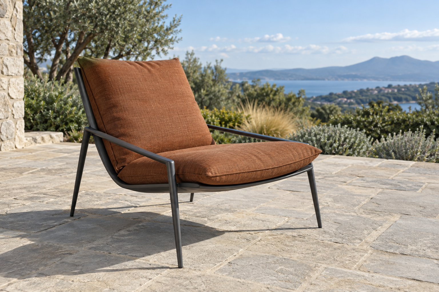 A low-profile powder-coated aluminum lounge chair with slim legs and a rust-toned cushion.