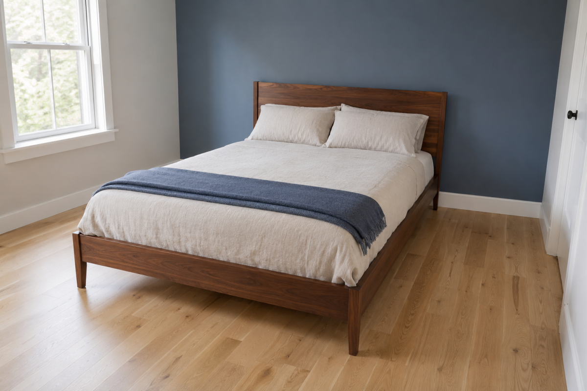 A queen bed sized correctly to a small bedroom, with real walking space on both sides
