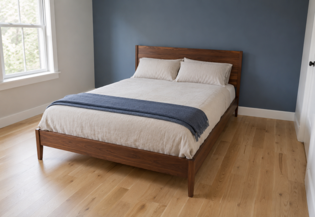 A queen bed sized correctly to a small bedroom, with real walking space on both sides