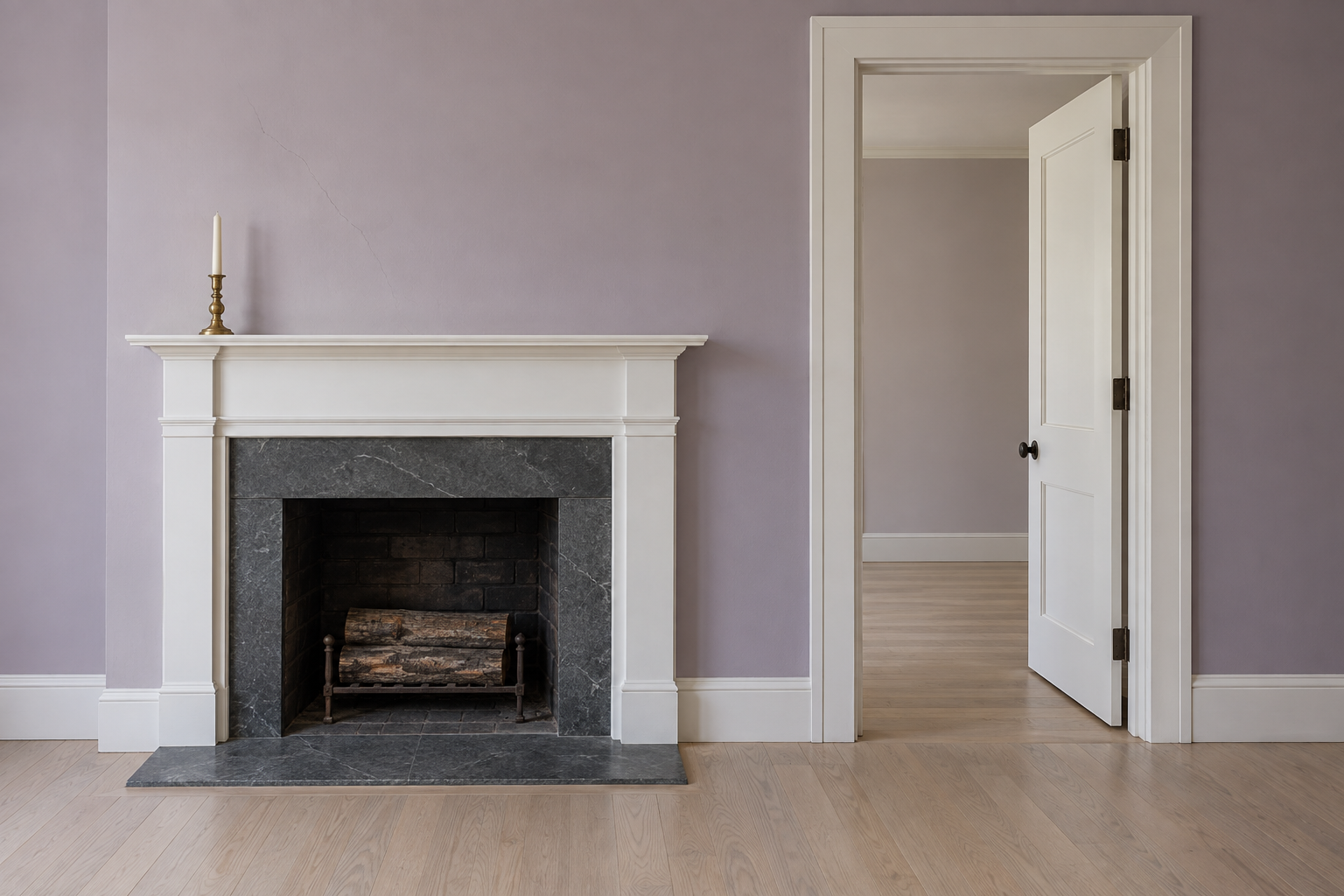 A fireplace with a white mantel seen straight on beside a doorway, the mantel shelf a little over half as high as the door opening.
