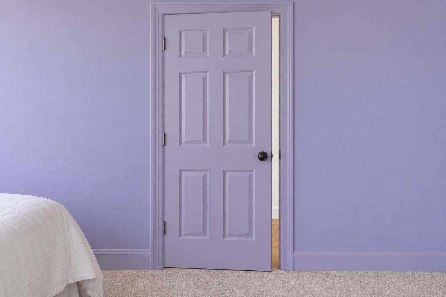 A lilac six-panel door standing ajar in a lilac wall, its edge painted lilac, with a white hallway beyond.